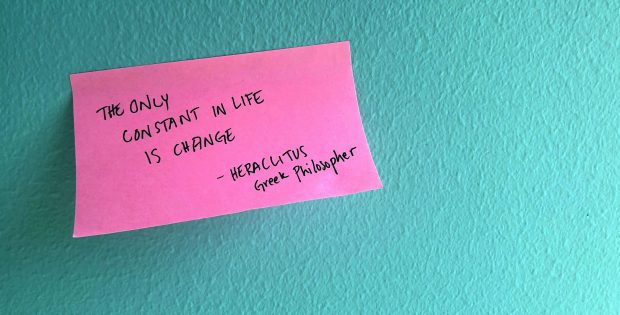 Post-it with the text The only constant in life is change -Heraclitus, Greek Philisopher written on it posted to a wall.