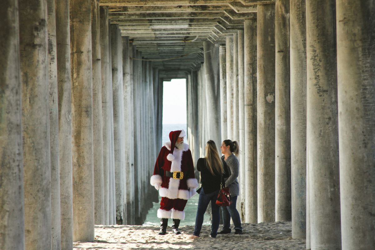 People and Santa Claus under a bridge
