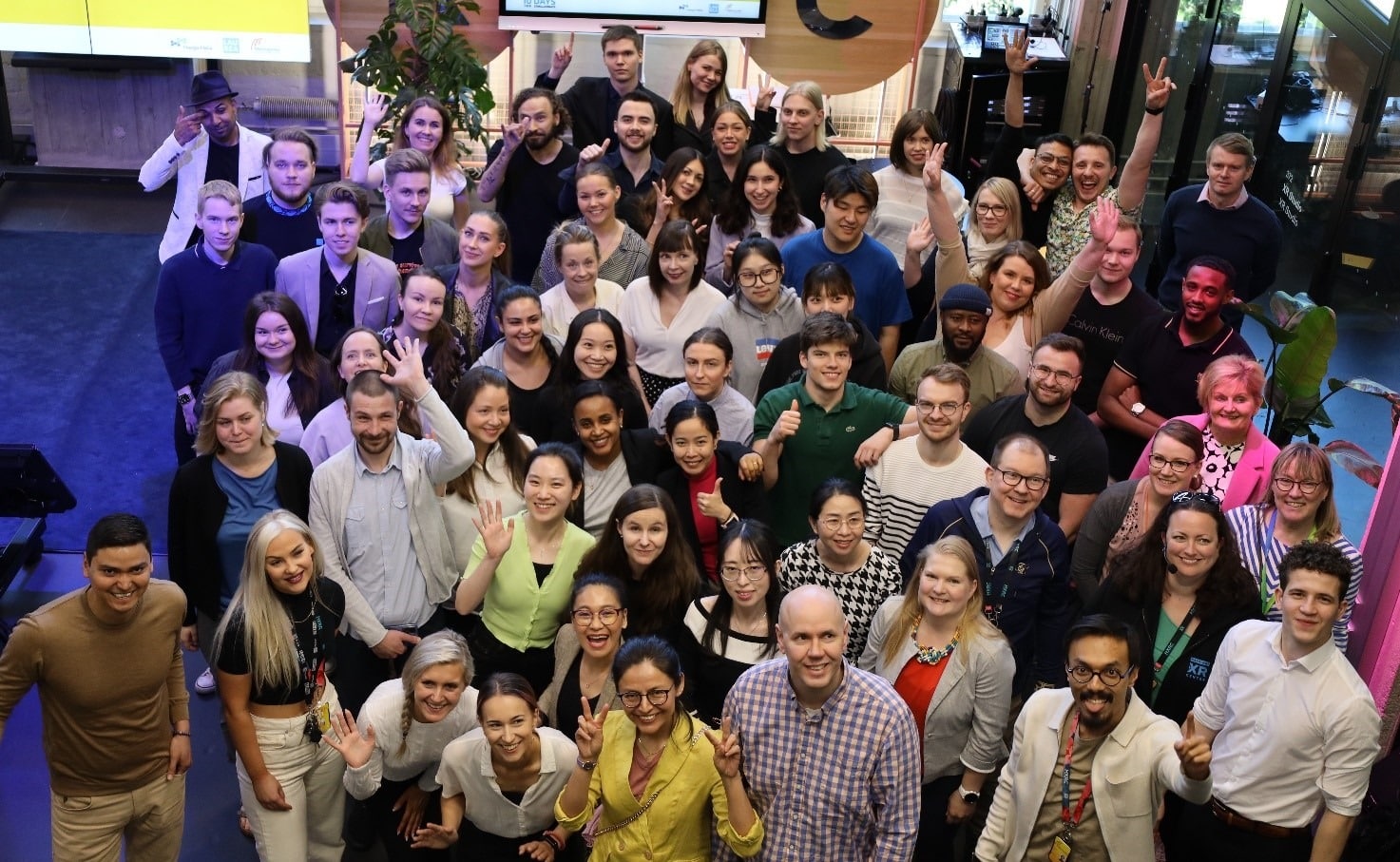 A group photo of 10D100C event participants, taken from bird perspective