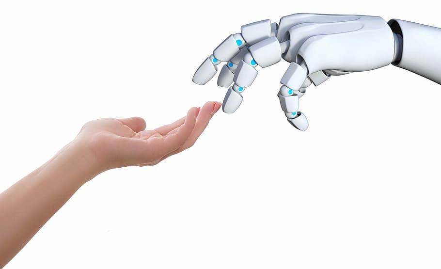 Ihmisen käsi ja robotin käsi kohtaavat.